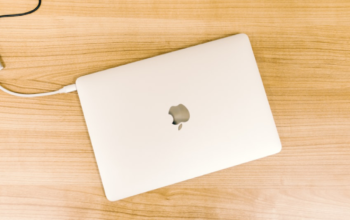 MacBook in flat day photography with white case.